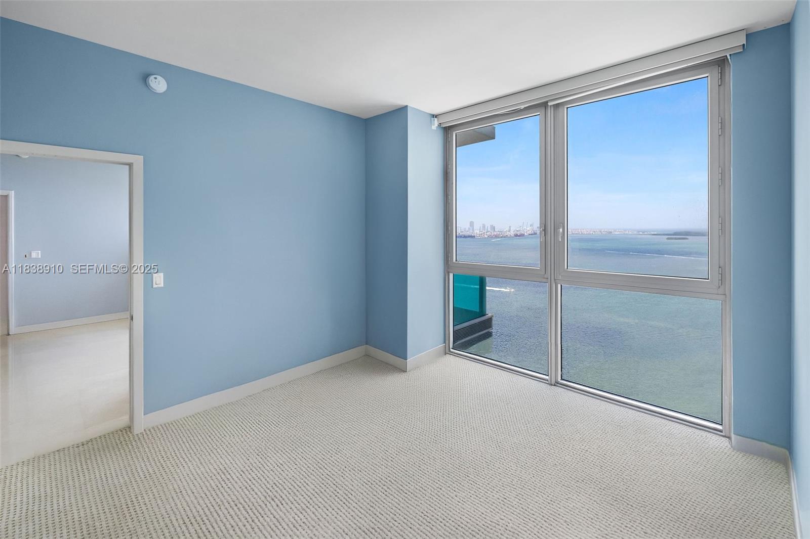 1331 Brickell Bay Drive, Unit 2909 Miami, FL 33131 - Photo 28 of 48 a view of an empty room with glass doors