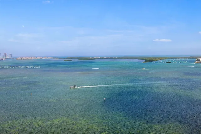 a view of a field with an ocean beach