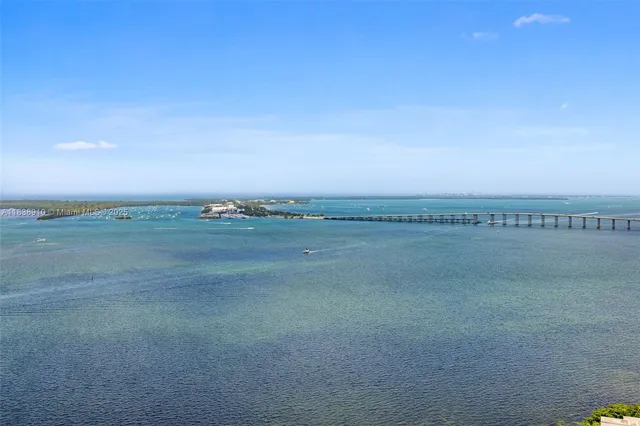 a view of a city with tall buildings in ocean