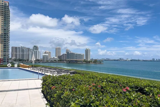a view of an ocean with city from a terrace