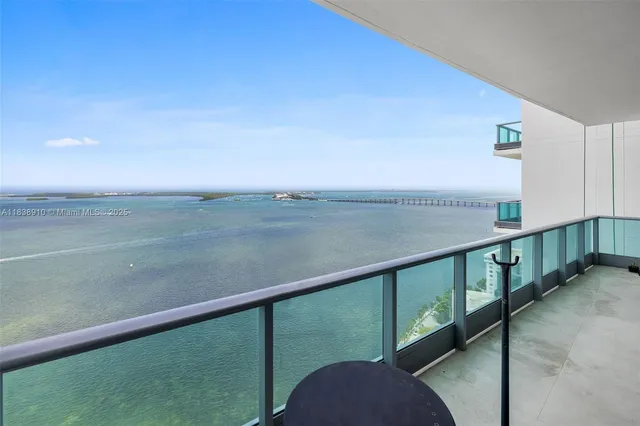 a view of a balcony with an ocean view