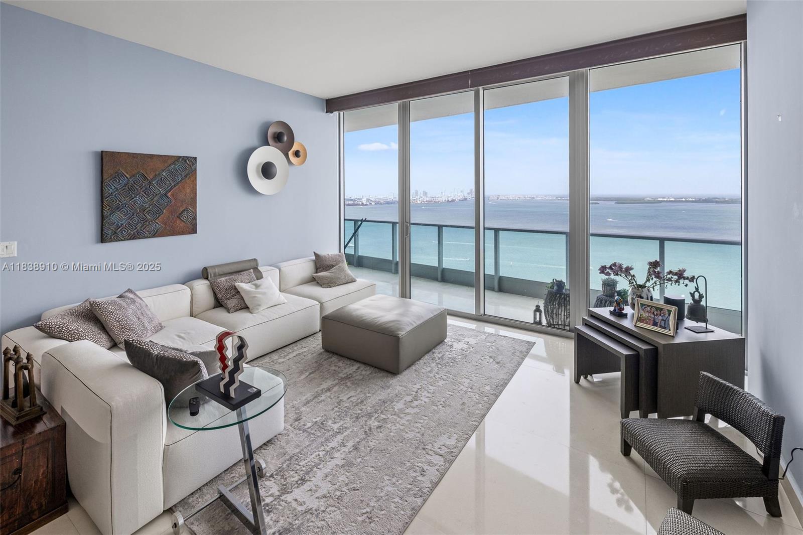 1331 Brickell Bay Drive, Unit 2909 Miami, FL 33131 - Photo 7 of 48 a living room with furniture and a floor to ceiling window