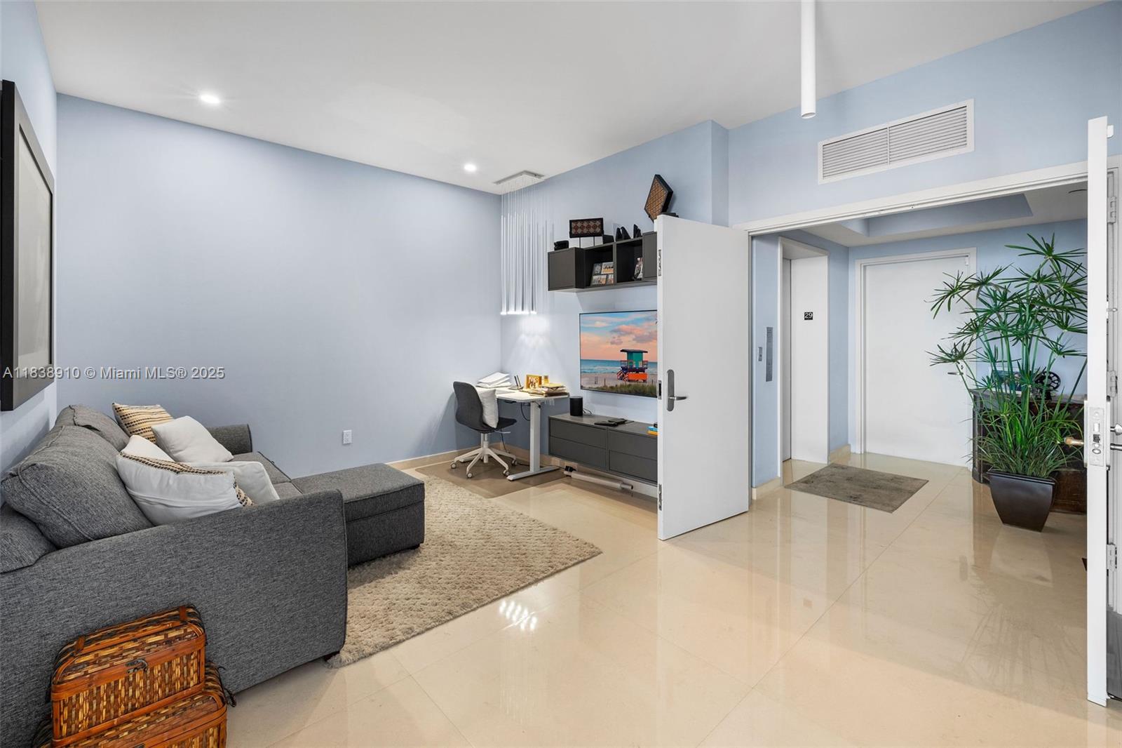 1331 Brickell Bay Drive, Unit 2909 Miami, FL 33131 - Photo 10 of 48 a living room with furniture and a potted plant