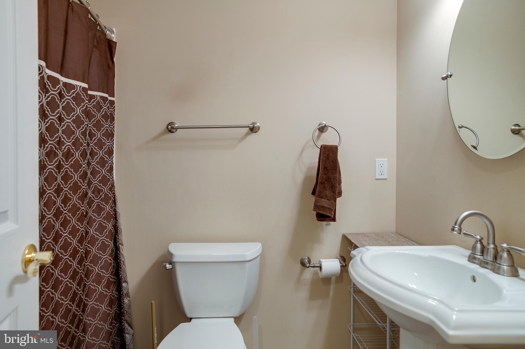 101 Saylers Creek Road Locust Grove, VA 22508 - Photo 39 of 89 a bathroom with a sink toilet and a mirror