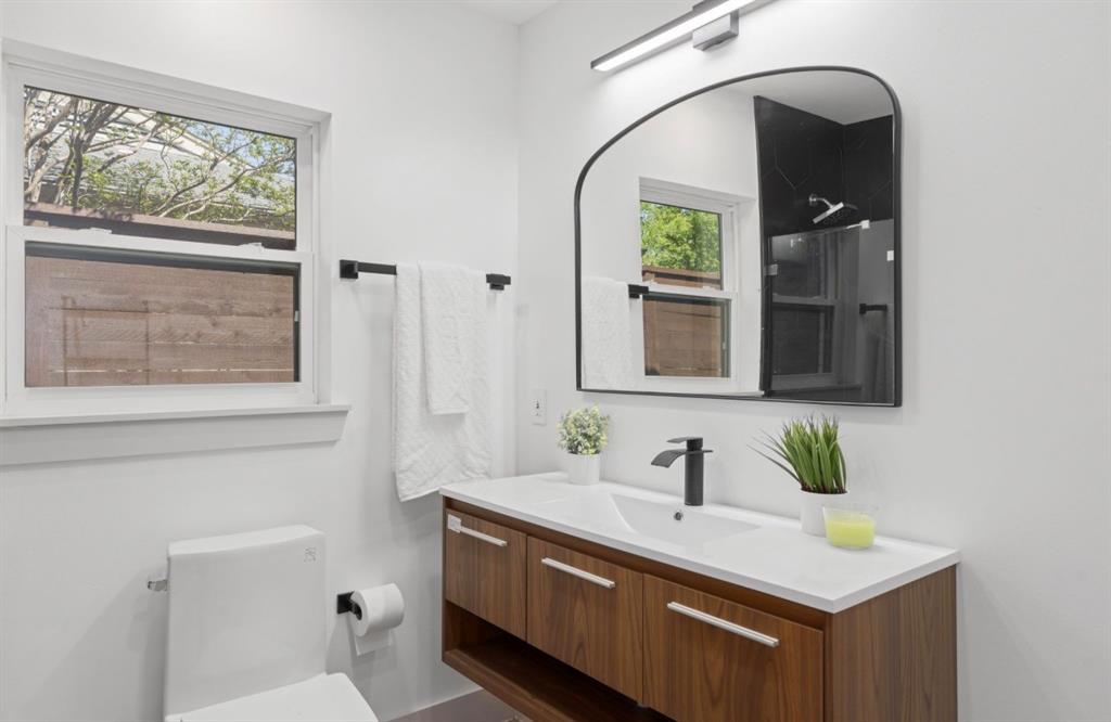 4927 Linnet Lane Dallas, TX 75209 - Photo 10 of 17 a bathroom with a sink and a mirror