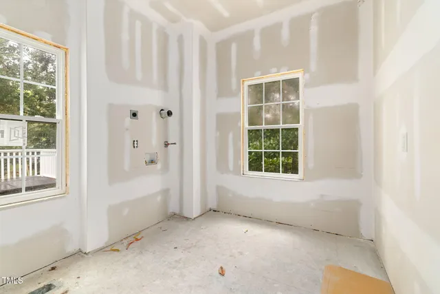a kitchen with a stove sink and cabinets