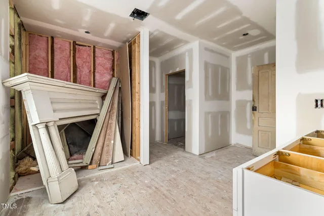 a bathroom with a window and a shower