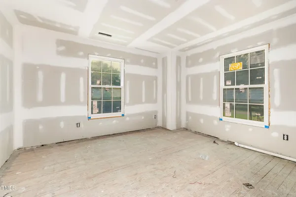 a bedroom with furniture and windows