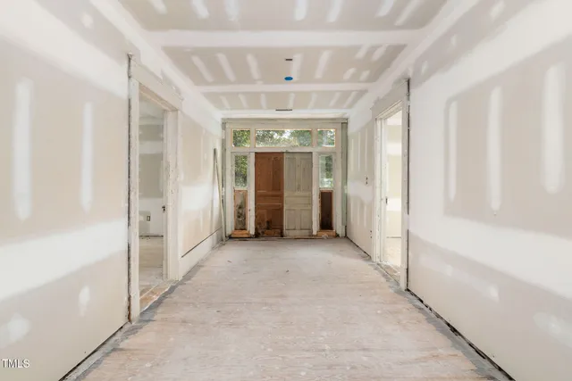 a view of a bathroom with a tub and shower