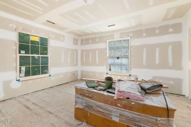 a room with a dresser and a mirror