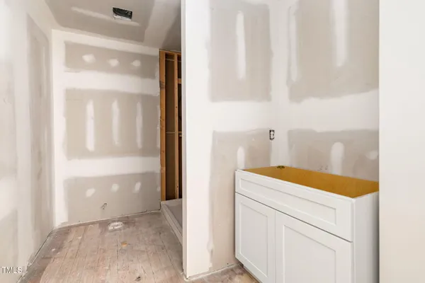 a living room with furniture and next to a window