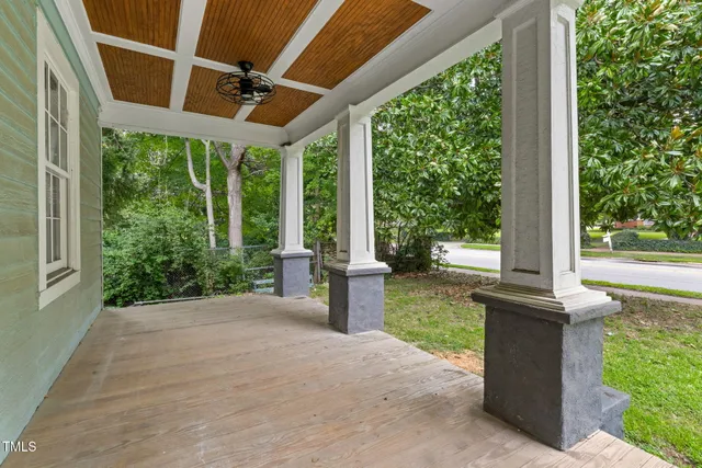 a view of a patio with table and chairs