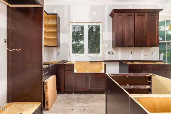 a kitchen with a sink and a refrigerator