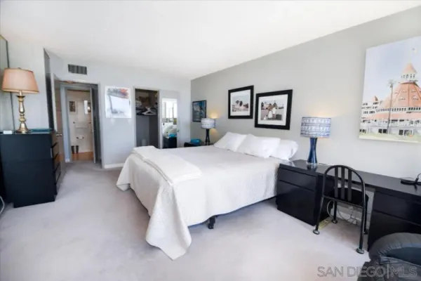 a bedroom with a bed and dresser