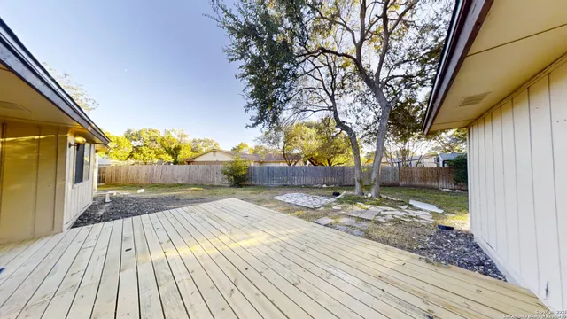 a view of a house with pool and sitting area