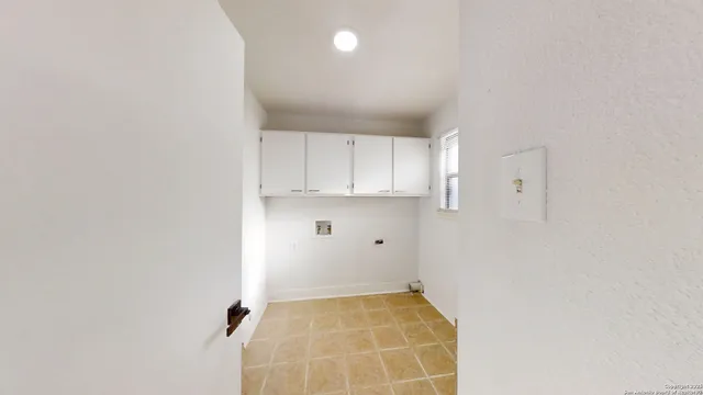 a view of a hallway view with wooden floor and staircase