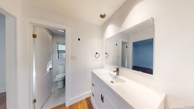 a bathroom with a sink and a mirror