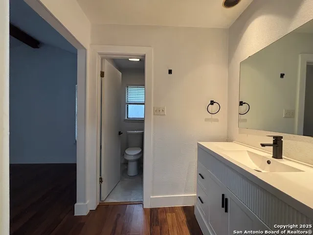 a view of a room with a ceiling fan
