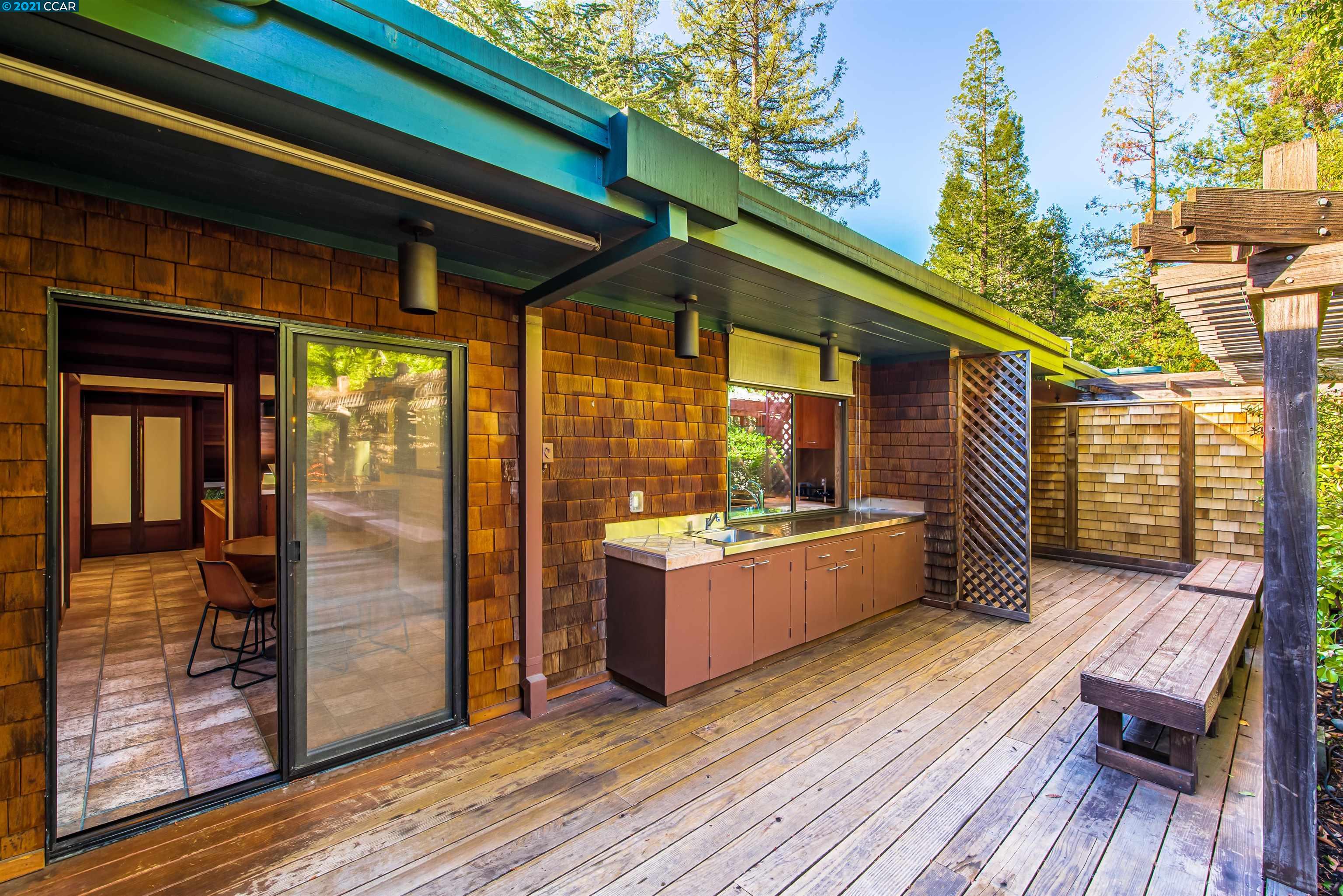 Pine Lane Lafayette, CA 94549 - Photo 27 of 39 a view of a patio with a table and chairs and wooden floor