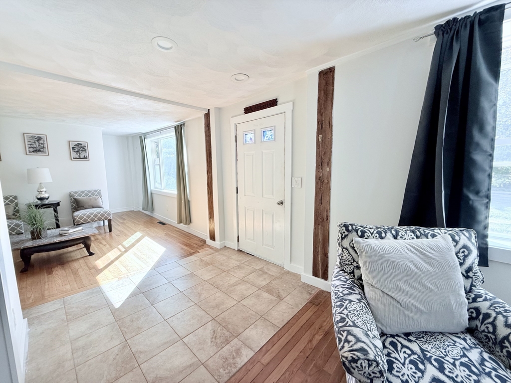 975 South Main Street Bellingham, MA 02019 - Photo 3 of 38 a bedroom with furniture and a flat screen tv
