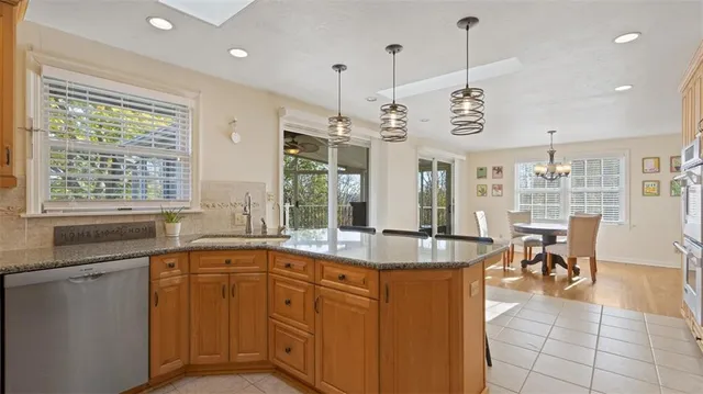 a very nice looking kitchen with a large window