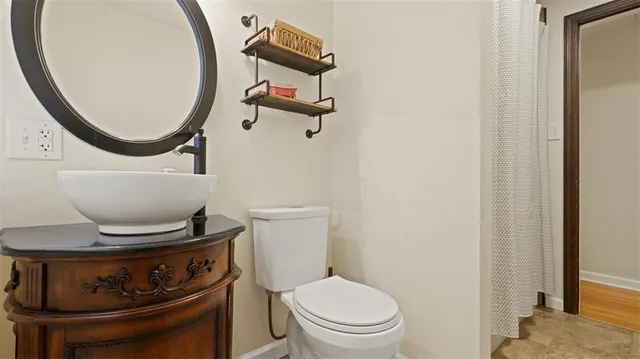 a bathroom with a toilet and a sink