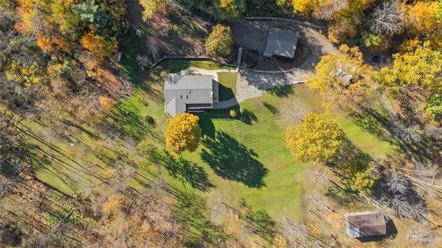 a aerial view of a house with a yard
