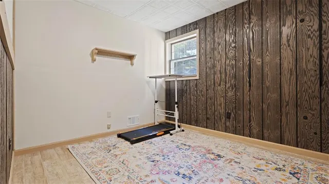 a view of a room with a wooden door