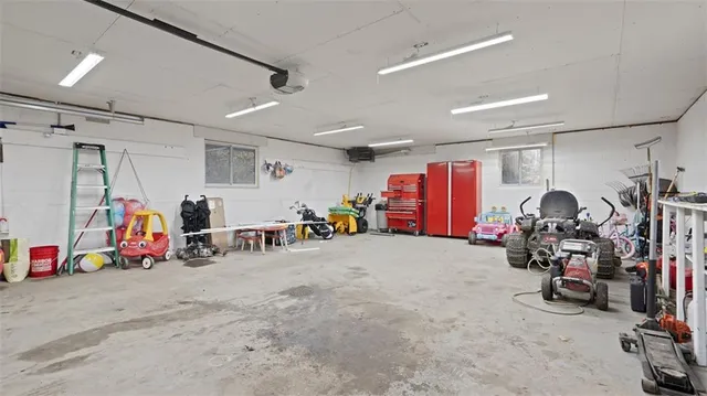a view of a garage with a bike and car
