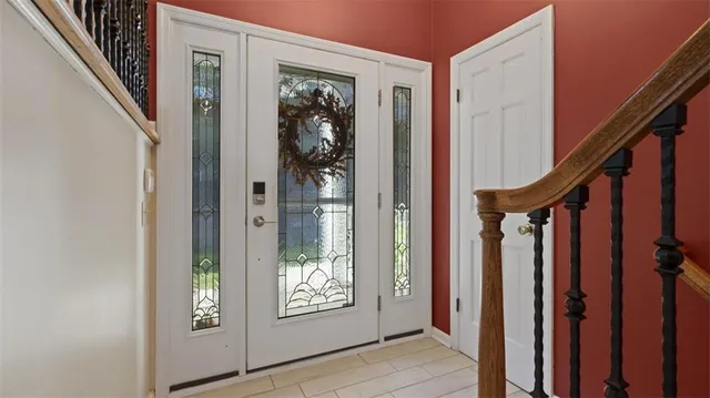 a view of an entryway with wooden floor