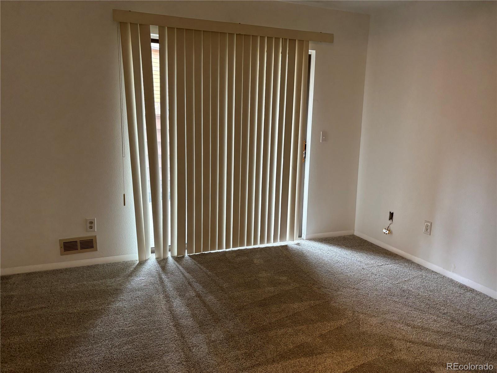 2275 South Buckley Road, Unit 101 Aurora, CO 80013 - Photo 8 of 14 an empty room with windows