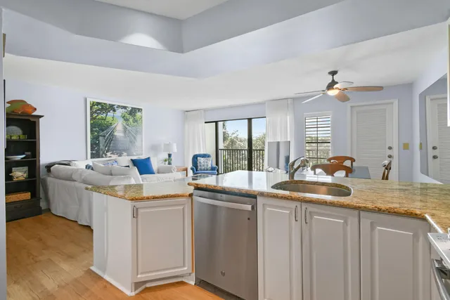 a kitchen with sink stove and window