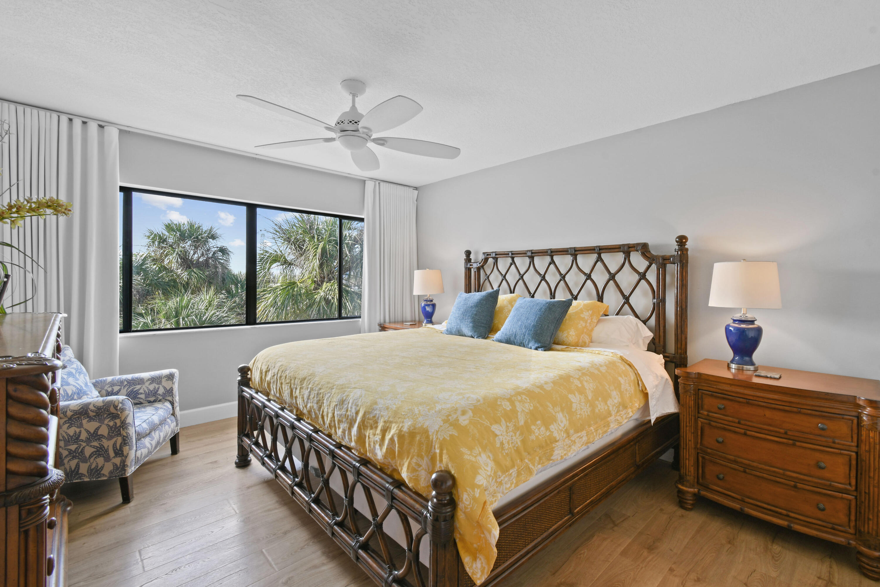 1605 Highway 1, Unit 301V6 Jupiter, FL 33477 - Photo 18 of 35 a bed sitting in a bedroom next to a window