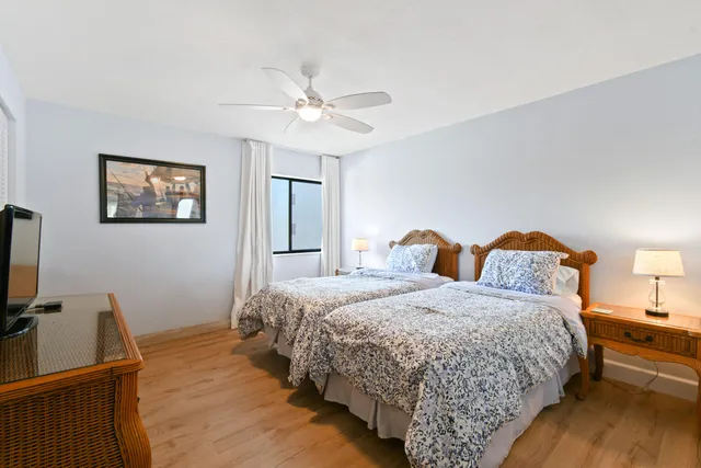 a bedroom with bed and window