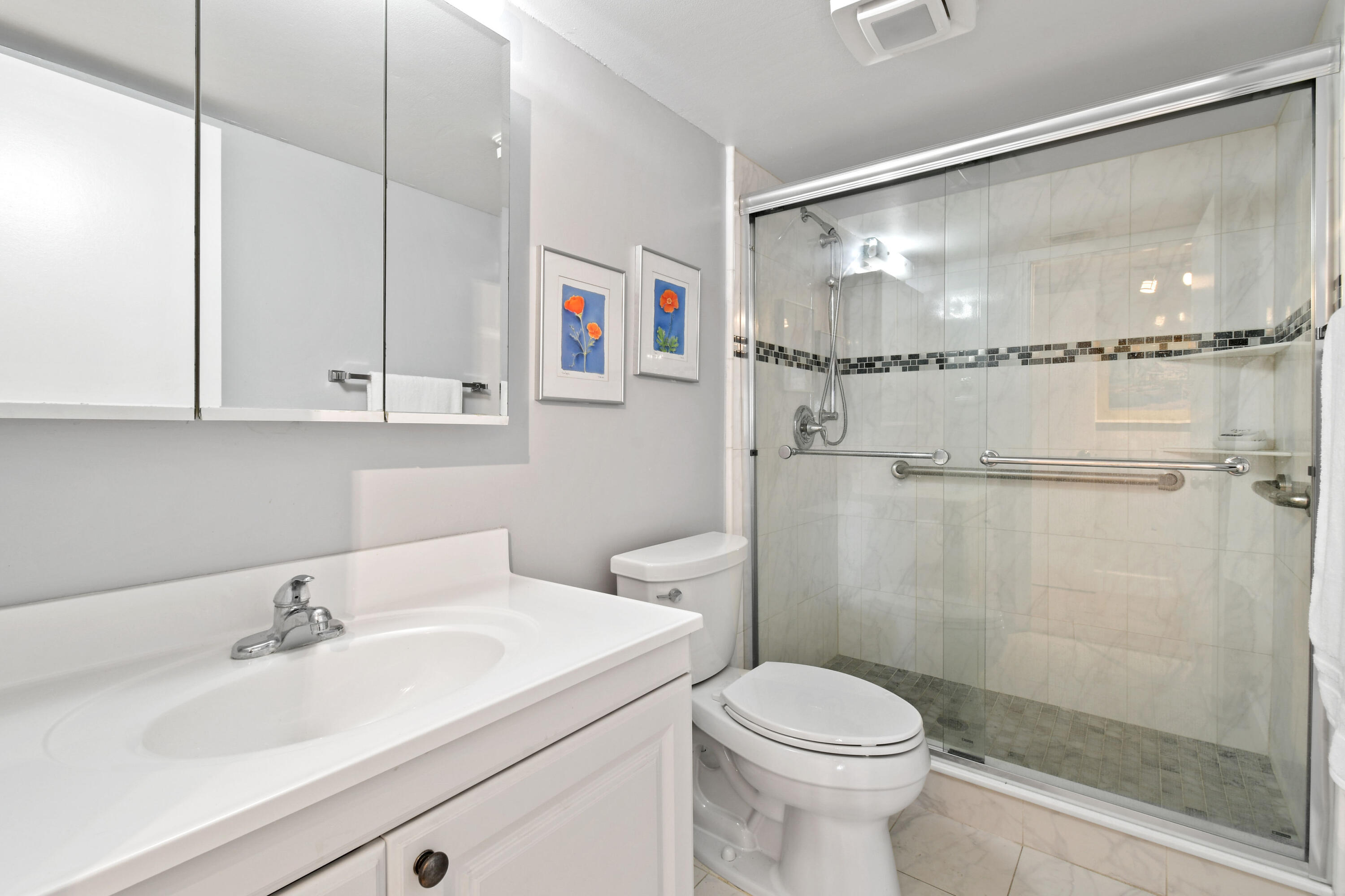 1605 Highway 1, Unit 301V6 Jupiter, FL 33477 - Photo 25 of 35 a bathroom with a sink toilet and shower
