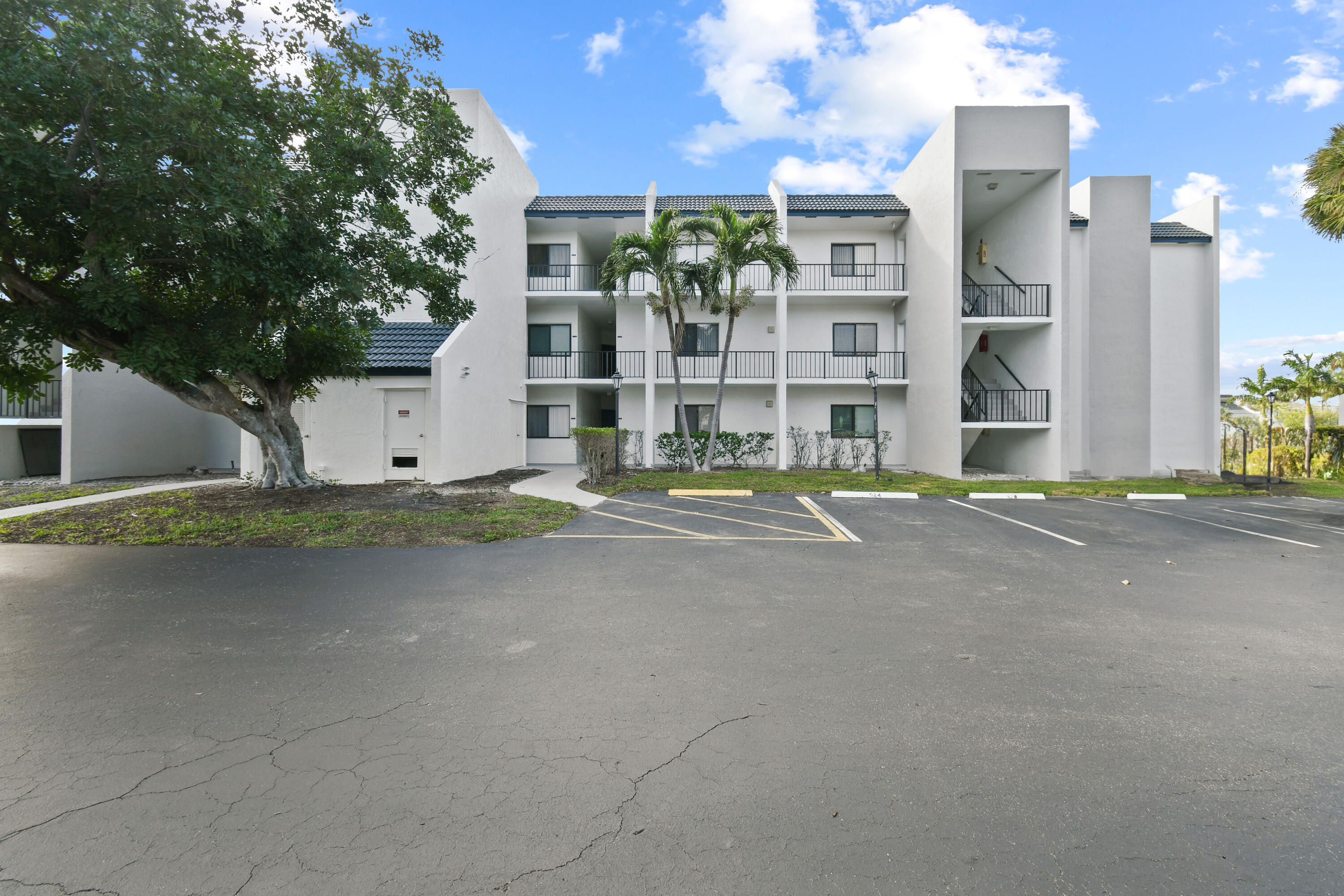 1605 Highway 1, Unit 301V6 Jupiter, FL 33477 - Photo 3 of 35 a view of a building with a street