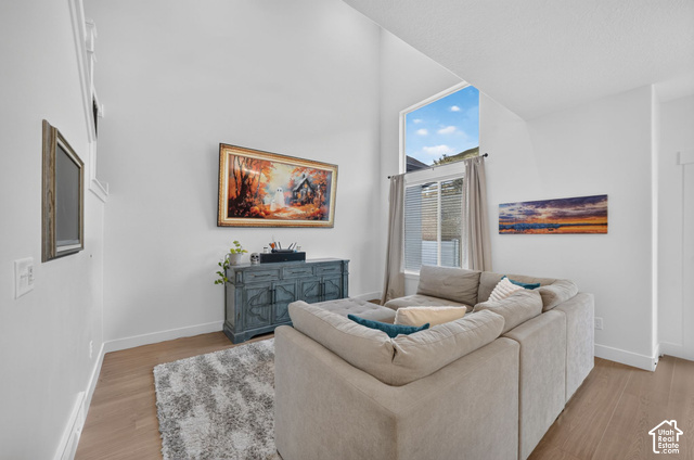 4751 Heartwood Road Mapleton, UT 84664 - Photo 5 of 33 Vaulted ceiling with a high window, light wood-finish flooring, and white wall finishes