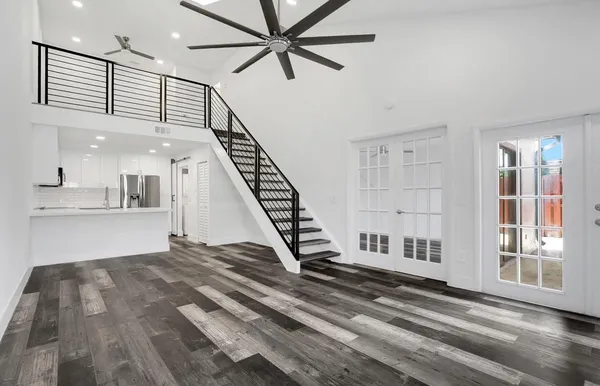 a view of entryway and hall with wooden floor