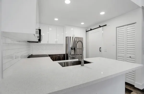 a bathroom with a sink and a shower