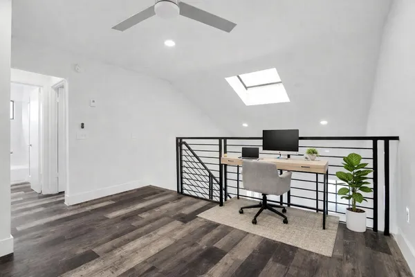 a view of a livingroom with furniture and a window