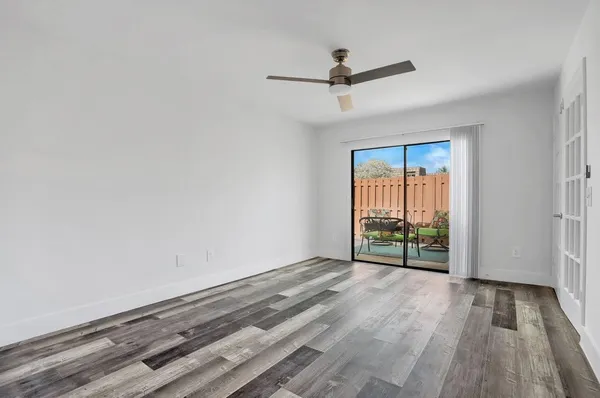 wooden floor in an empty room with a window