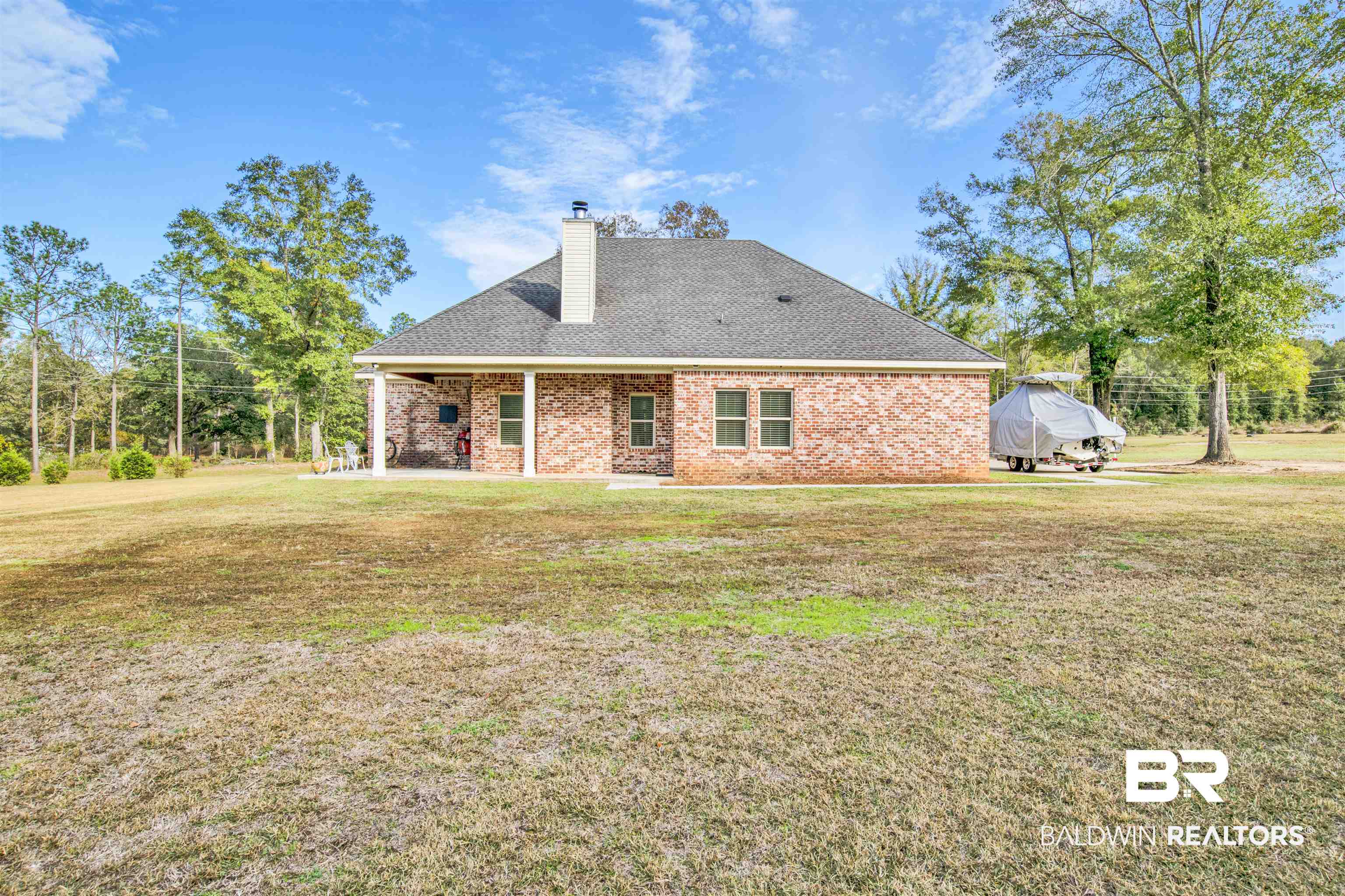 2440 Johnson Road West Mobile, AL 36695 - Photo 38 of 40 Rear view of house featuring a lawn