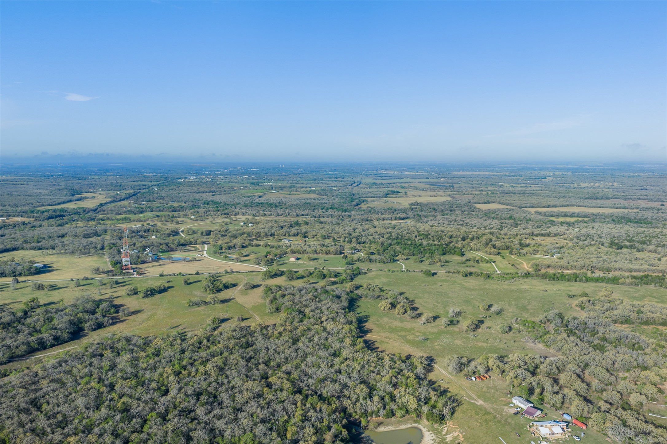 2313 Highway 79 Milano, TX 76556 - Photo 4 of 40 Expansive rural landscape featuring a mix of mature woodlands and open fields