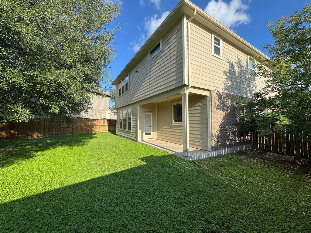 14100 McCoy Loop, Unit 1 Austin, TX 78717 - Photo 38 of 40 A well-maintained fenced backyard offers ample space for outdoor enjoyment.