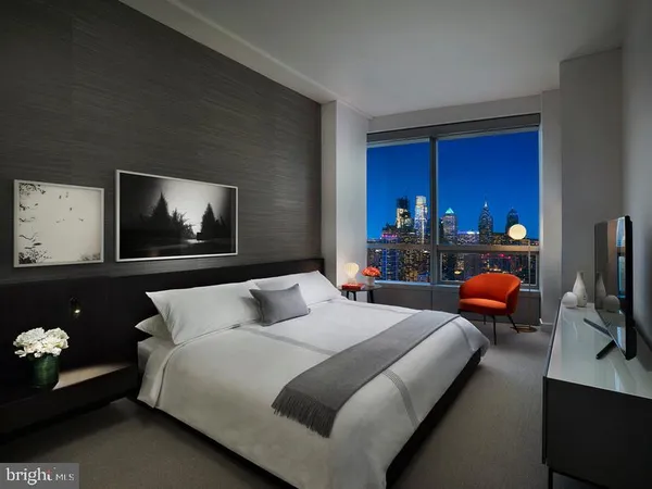 a bedroom with bed and window