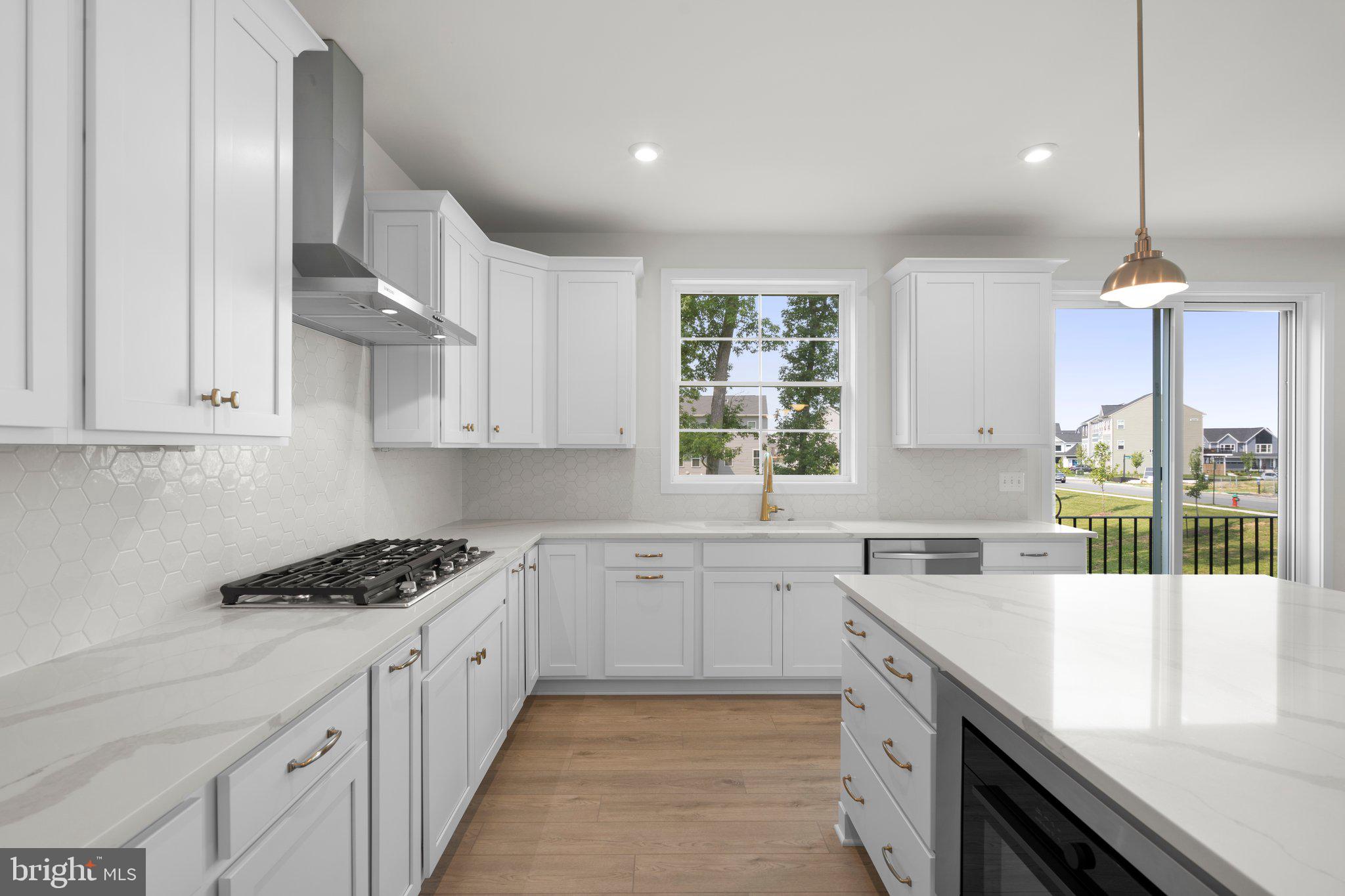100 Alabaster Lane Stephenson, VA 22656 - Photo 12 of 44 a kitchen with cabinets and window