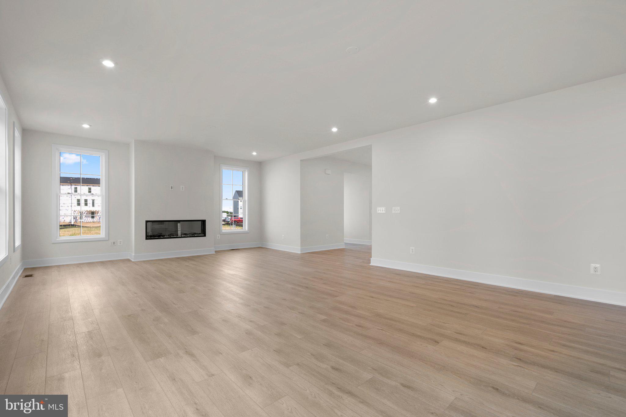 100 Alabaster Lane Stephenson, VA 22656 - Photo 14 of 44 a view of empty room with wooden floor and window