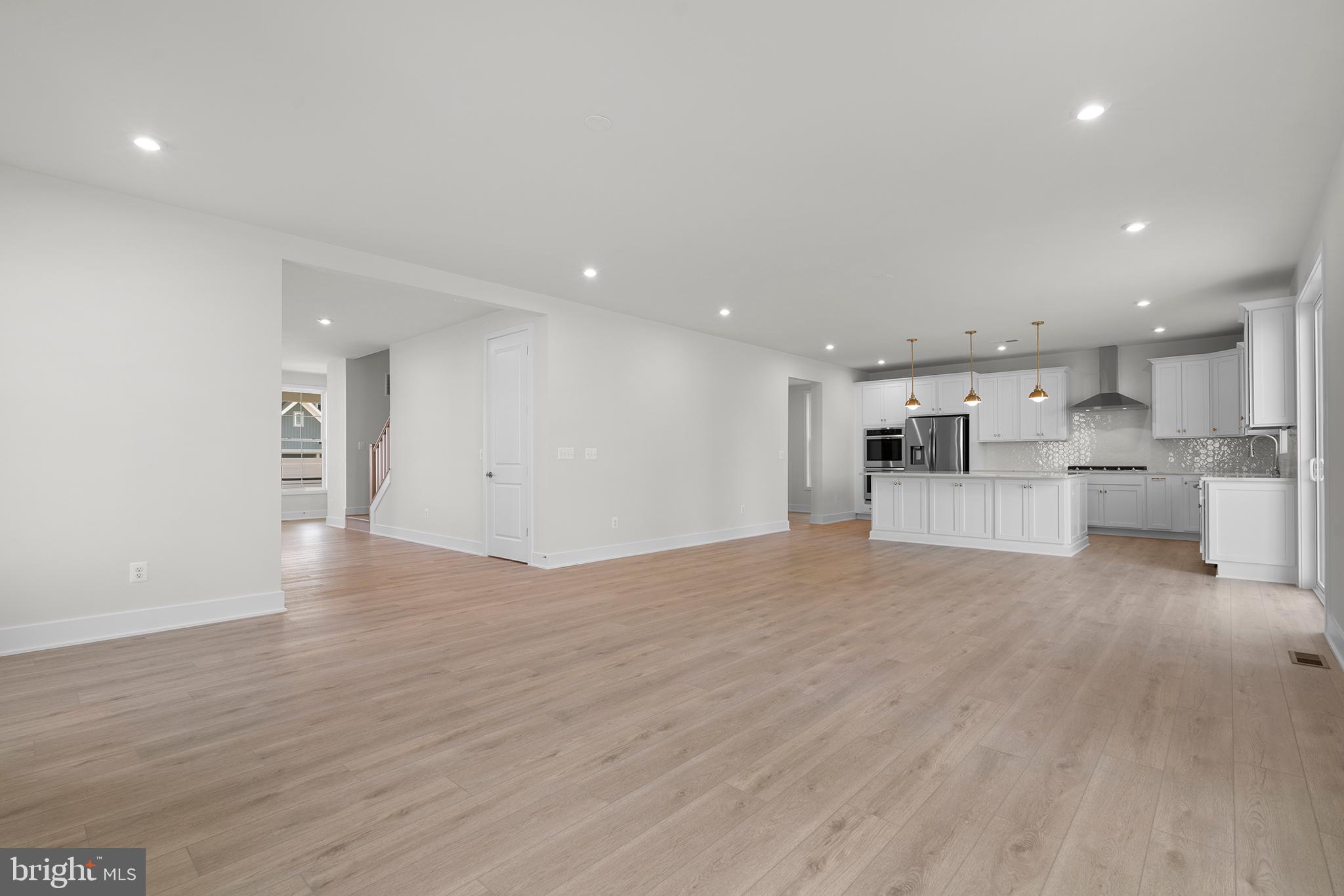 100 Alabaster Lane Stephenson, VA 22656 - Photo 15 of 44 a view of kitchen with kitchen island wooden floor and center island