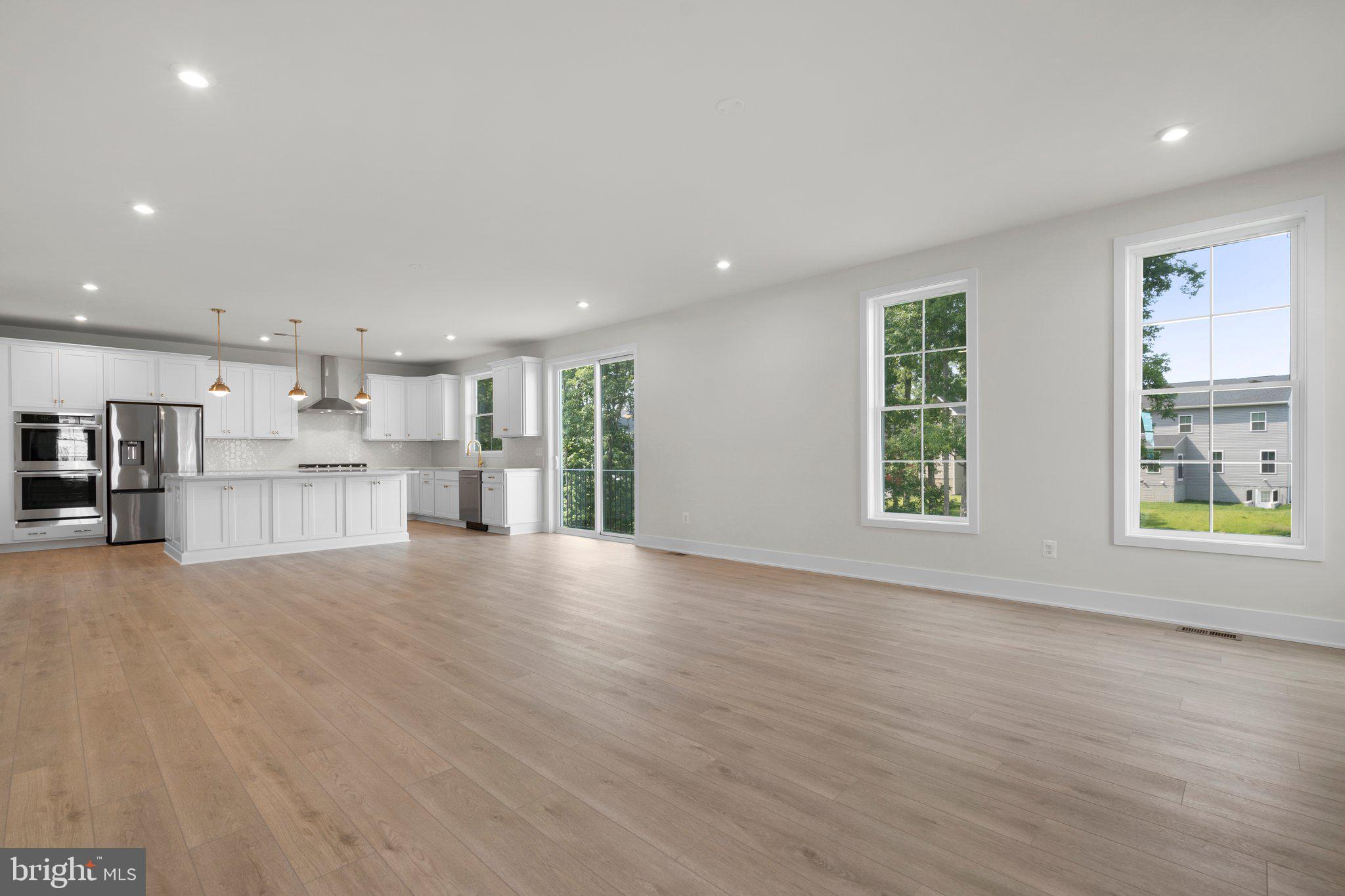 100 Alabaster Lane Stephenson, VA 22656 - Photo 16 of 44 an empty room with wooden floor and windows