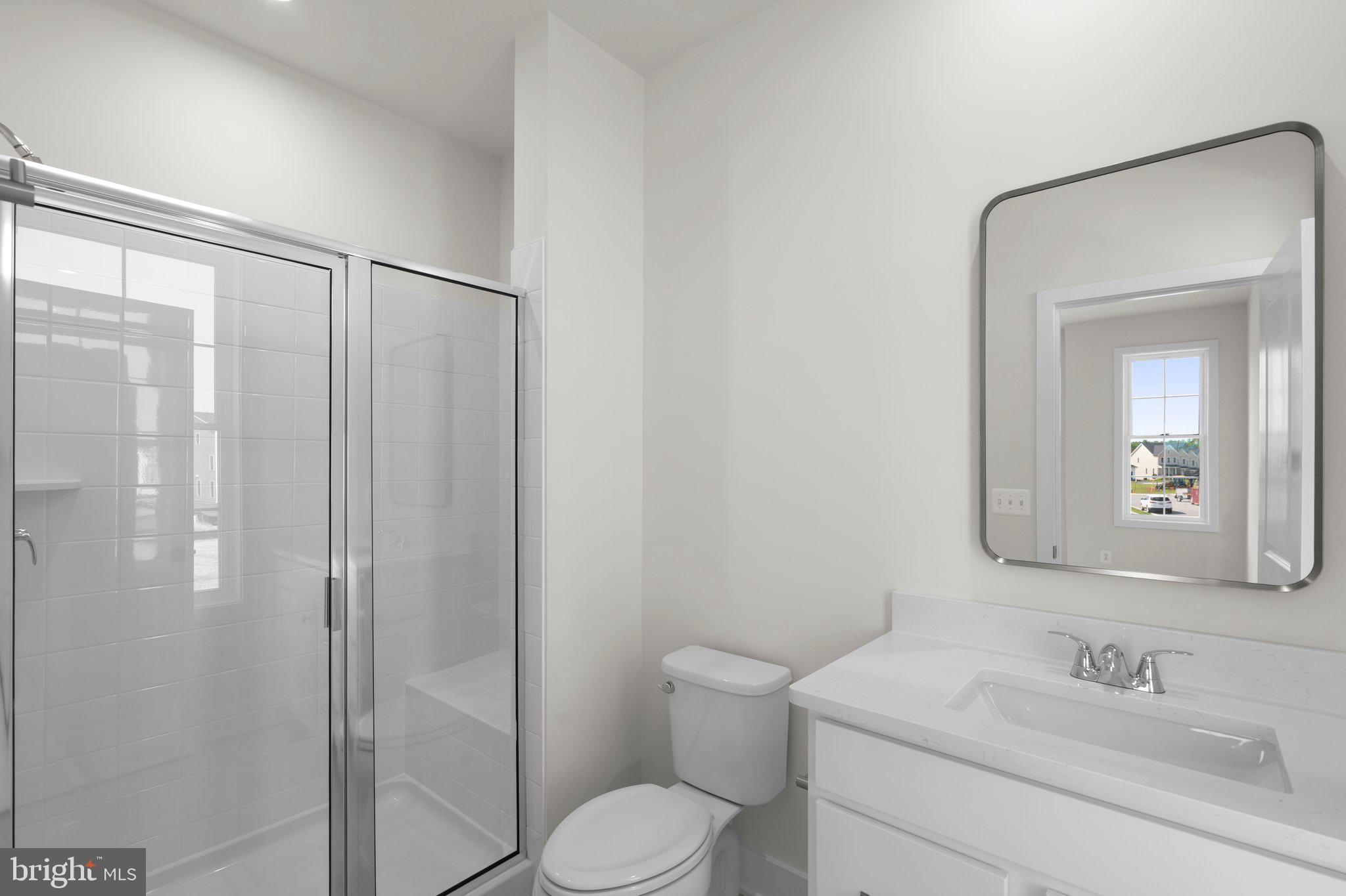 100 Alabaster Lane Stephenson, VA 22656 - Photo 29 of 44 a bathroom with a toilet a sink and shower